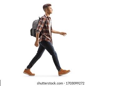 Full Length Profile Shot Of A Male Student With A Backpack Walking Isolated On White Background