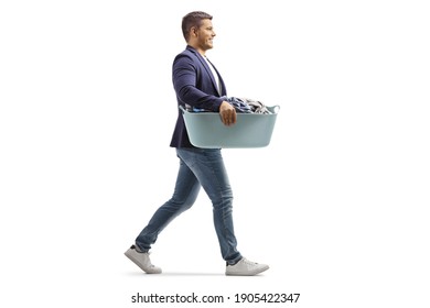 Full length profile shot of a man with a laundry basket walking isolated on white background - Powered by Shutterstock