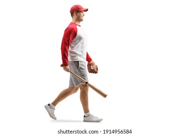 Full length profile shot of a man with a baseball bat and glove walking isolated on wahite background - Powered by Shutterstock