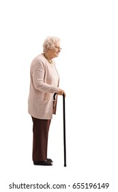 Full Length Profile Shot Of A Mature Woman With A Cane Waiting In Line Isolated On White Background