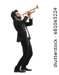 Full length profile shot of a musician playing a trumpet isolated on white background
