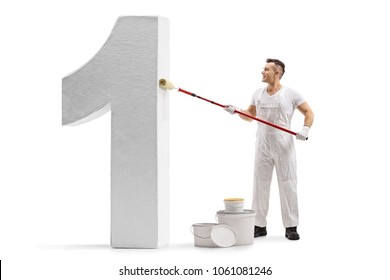 Full length profile shot of a painter painting a number one figure isolated on white background