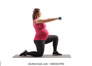 Full Length Profile Shot Of A Pregnant Woman Kneeling And Exercising With Dumbbells On A Mat Isolated On White Background