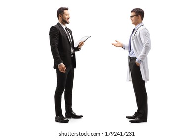 Full Length Profile Shot Of Professional Man In A Suit Talking To A Male Doctor Isolated On White Background