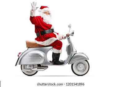 Full length profile shot of Santa Claus riding a vintage motorbike and waving isolated on white background - Powered by Shutterstock