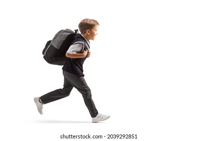 Full Length Profile Shot Of A Schoolboy In A Uniform Running Fast Isolated On White Background