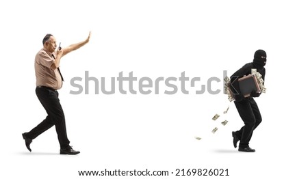 Full length profile shot of a security officer chasing a burgler running with a suitcase of money isolated on white background