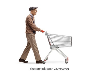 Full Length Profile Shot Of A Senior Man Walking And Pushing An Empty Shopping Cart Isolated On White Background