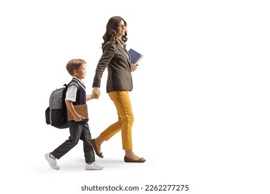 Full length profile shot of a teacher and a schoolboy walking and holding hands isolated on white background - Powered by Shutterstock