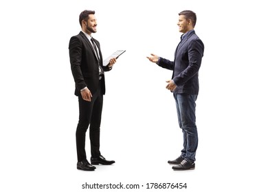 Full Length Profile Shot Of Two Male Colleagues Talking Isolated On White Background