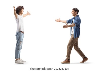 Full length profile shot of two male friends meeting each other with arms wide open isolated on white background - Powered by Shutterstock