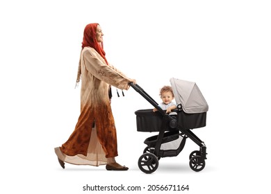 Full Length Profile Shot Of A Woman Wearing A Hijab And Pushing A Baby Boy In A Stroller Isolated On White Background