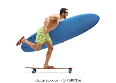 Full length profile shot of a young man holding a surfing board and riding a longboard isolated on white background - Powered by Shutterstock