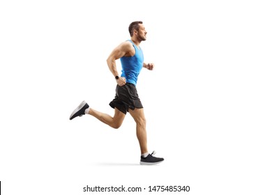 Full Length Profile Shot Of A Young Man Jogging Isolated On White Background