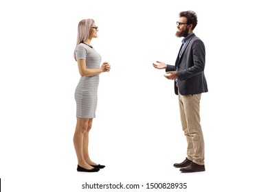 Full Length Profile Shot Of A Young Woman Listening To A Bearded Man Talking Isolated On White Background