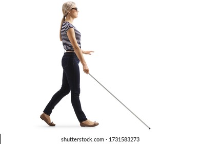 Full Length Profile Shot Of A Young Blind Woman Walking With A White Cane Isolated On White Background