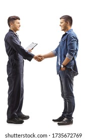 Full Length Profile Shot Of A Young Mechanic Shaking Hands With A Casual Man Isolated On White Background