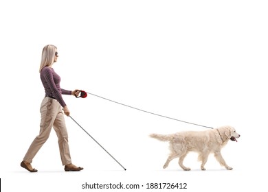 Full Length Profile Shot Of A Young Blind Woman With A Dog On A Lead Isolated On White Background