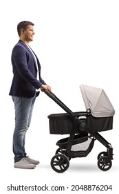 Full Length Profile Shot Of A Young Man Pushing A Baby Carriage Isolated On White Background