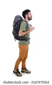 
				Full length profile shot of a young hiker walking isolated on white background. Young hiker standing looking side on copy space. Studio shot