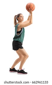 Full Length Profile Shot Of A Young Woman Throwing A Basketball Isolated On White Background