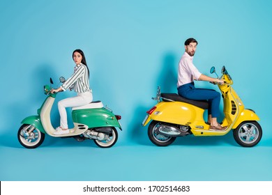 Full Length Profile Side Photo Of Shocked Two People Man Woman Ride Motor Bike Impressed By High Fast Speed Scream Wow Omg Wear Shirt White Pants Trousers Isolated Over Blue Color Background