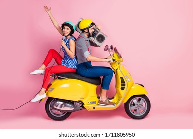 Full Length Profile Side Photo Crazy Cool Rock Stars Two People Motorcyclist Traveling Singers Rider Drivers Ride Motor Bike Man Hold Boom Box Woman Sing Mic Isolated Pink Color Background