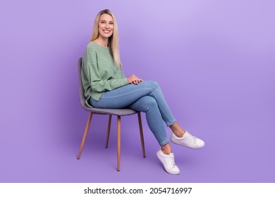 Full length profile side photo of young cheerful woman sit chair comfort talk-show isolated over violet color background
