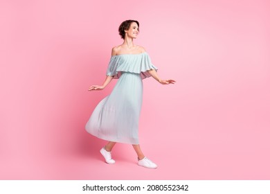 Full Length Profile Side Photo Of Young Girl Happy Positive Smile Go Walk Look Empty Space Isolated Over Pastel Color Background