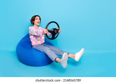 Full Length Profile Side Photo Of Young Girl Look Empty Space Ride Vehicle Road Isolated Over Blue Color Background