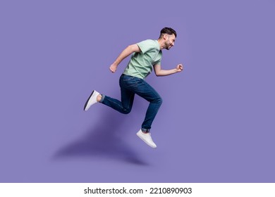 Full Length Profile Side Photo Of Sportive Ambitious Stylish Man Move Ahead Reach Dream Aim Empty Space Isolated On Purple Color Background