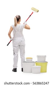 Full Length Rear Shot Of A Female Painter Painting With A Paint Roller Isolated On White Background