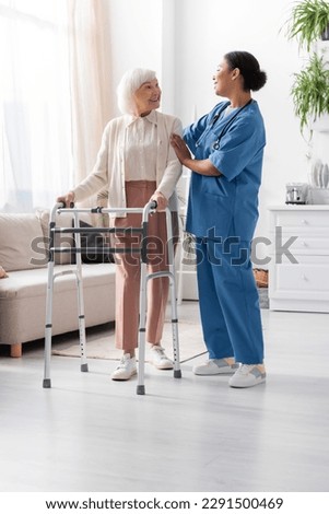 Similar – Image, Stock Photo Woman with walker