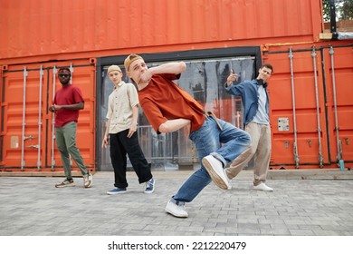 Full Length Shot Of All Male Dance Team Performing Hip-hop In Urban City Setting