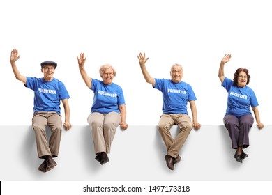 Full length shot of a elderly volunteers sitting on panel and waving isolated on white background - Powered by Shutterstock