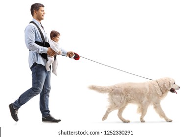 Full Length Shot Of A Father Walking A Dog And Carrying A Baby In A Carrier Isolated On White Background