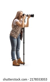 Full Length Shot Of A Female Photo Journalist Using A Camera On A Stand Isolated On White Background