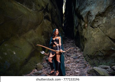 Full length shot of a female warrior with a bow and arrows wandering through the woods copyspace archer archery fighter Amazon tribal traditional feminism power confidence skilled.