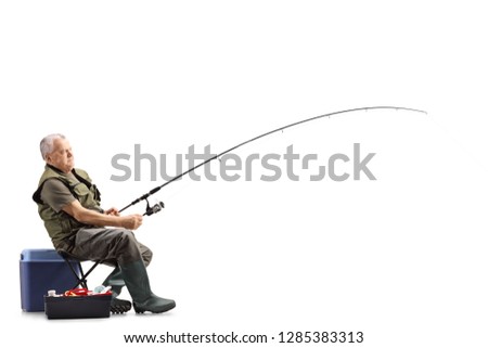 Full length shot of a fisherman on a chair with a fishing rod waiting for a catch isolated on white background