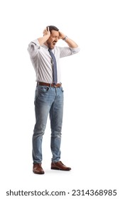 Full length shot of a furious professional man holding his head isolated on white background - Shutterstock ID 2314368985