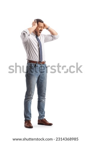Full length shot of a furious professional man holding his head isolated on white background