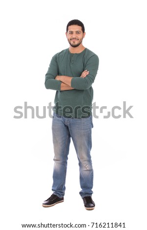 Full length shot of handsome man wearing green T-shirt and jeans, guy smiling and standing confidently, isolated on white background