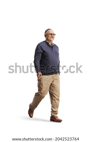 Full length shot of a happy mature man smiling and walking isolated on white background
