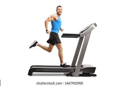 Full Length Shot Of A Male Athlete Running Fast On A Treadmill Isolated On White Background