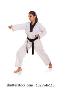 Full Length Shot Of Martial Artist Woman In Her Fighting Stance, Puncing With Right Hand, Isolated On White Background