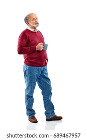 Full Length Shot Of Senior Bearded Man Standing And Holding Coffee Cup Over White Background