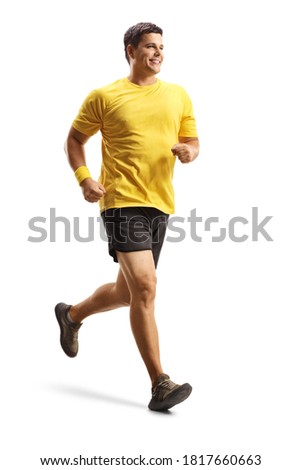 Full length shot of a smiling man in a yellow t-shirt running isolated on white background