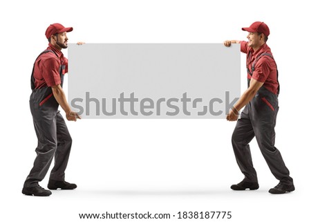 Full length shot of two male workers carrying a blank panel board isolated on white background