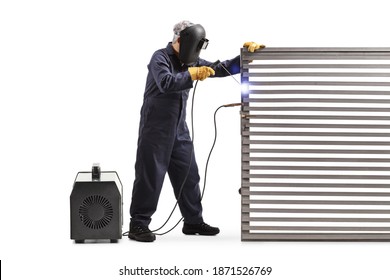 Full length shot of a welder welding a metal door isolated on white background - Powered by Shutterstock