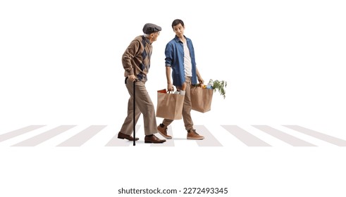 Full length shot of a young man helping a senior with grocery bags on a pedestrian crossing isolated on white background - Powered by Shutterstock